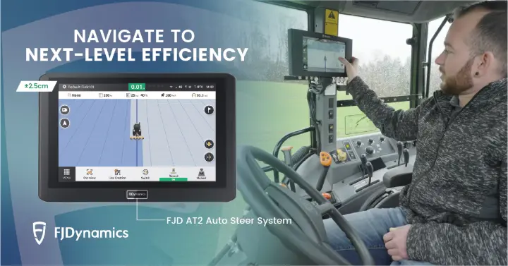 Farmer using the FJD AT2 Auto Steer System in a tractor