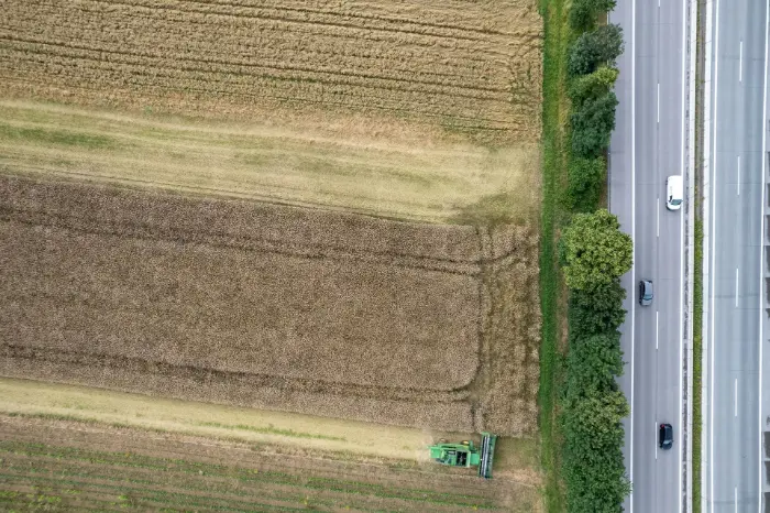 Aerial view of farmland and highway