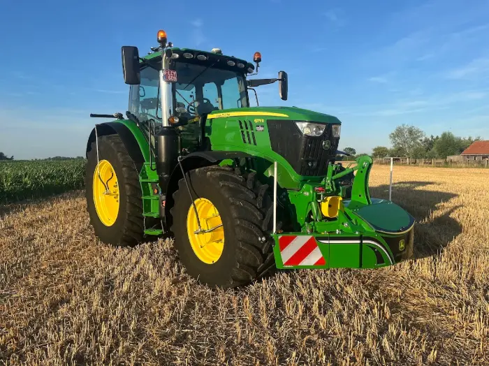 Green tractor with precision tech