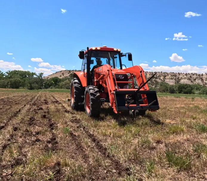 Using a smart farming tractor to till a field