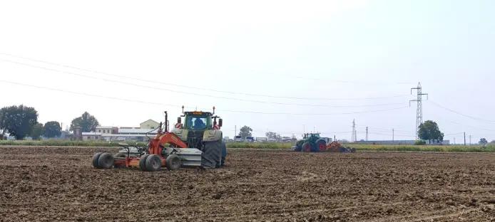 Using a tractor to till a field