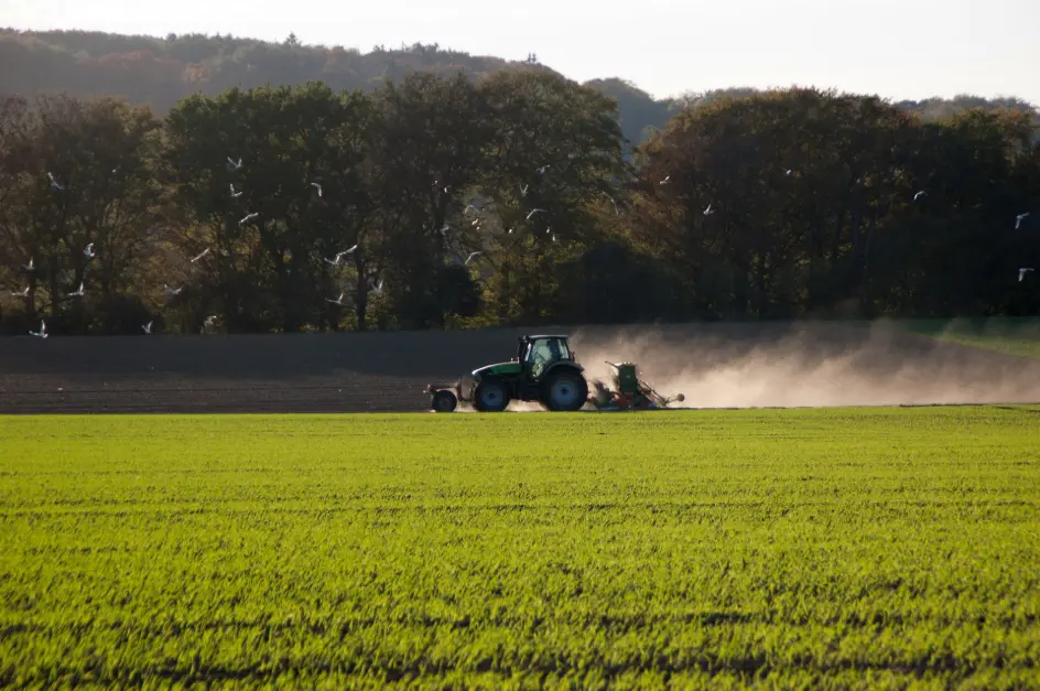 A standard tractor equipped with a universal hydraulic autosteer kit, upgraded for high-precision and efficient field operations.